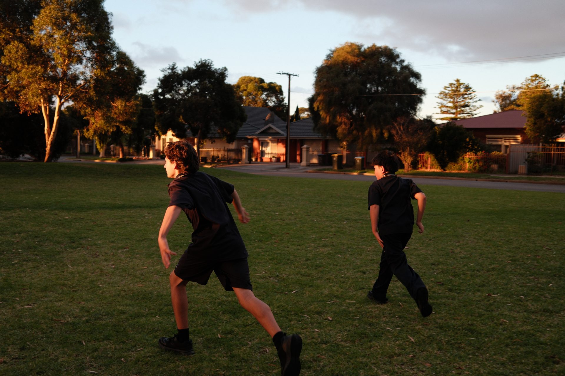 Junior youth running at sunset