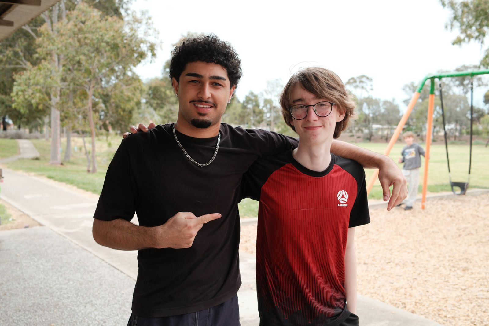 An animator and a junior youth smiling together