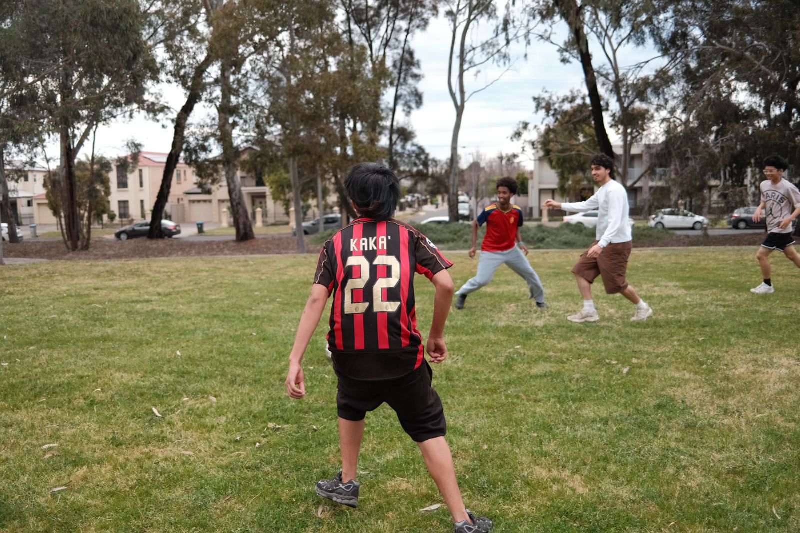A junior youth in the middle of a soccer game at Community Day